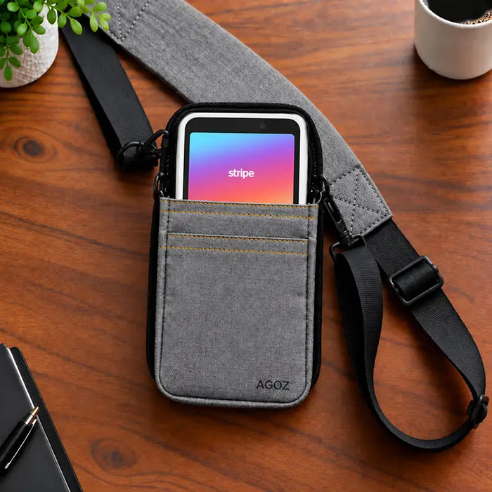 Gray Agoz crossbody holster with Stripe Reader S700/S710 and shoulder strap on a tabletop