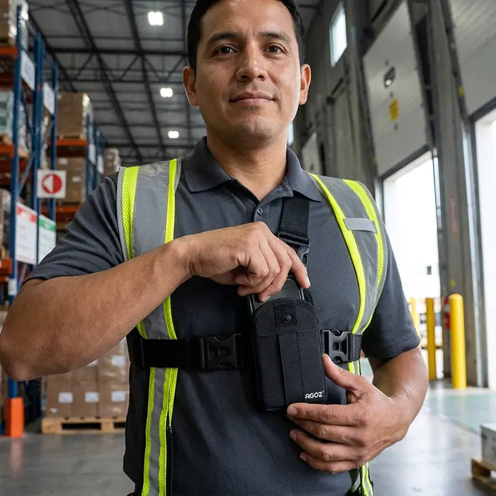 Warehouse worker wearing a Chest Harness Holster for Keyence Mobile Scanners with the pouch positioned securely on the front of the chest