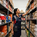 Janam mobile computer waist belt holster worn by retail stockroom employee during shelf inventory workflow