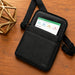 Black AgozTech tablet carrying case with shoulder strap displayed on a wood tabletop with a JLT tablet inside.