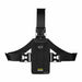 Front view: Black Agoz chest harness holster with adjustable shoulder and waist straps, quick-release buckles, and a secured Sonim enterprise communication terminal.