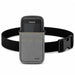 A Honeywell scanner handheld in a gray waist case with a black belt strap on a white background