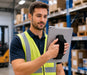Warehouse employee using iPad with handgrip