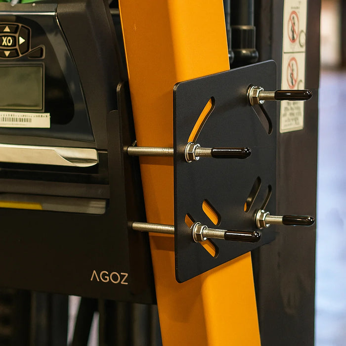 Close-up of Agoz metal forklift mounting bracket secured to a forklift pillar with metal screws and plates