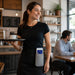 Server wearing Rugged myPOS Payment Terminal Holster with Waist Belt during tableside service