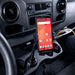 Point Mobile handheld computer mounted in an AgozTech cup holder cradle mount inside a vehicle cabin.