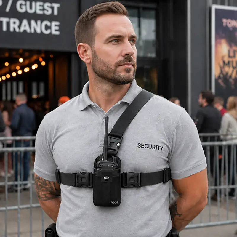 Security worker wearing Icom radio chest harness holster at event entrance