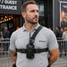 Security worker wearing Icom radio chest harness holster at event entrance
