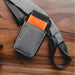 Grey Agoz crossbody pouch holding Sunmi POS handheld terminal