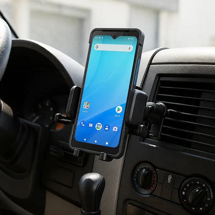 Unitech mobile scanner secured in an AgozTech air vent vehicle cradle mount inside a commercial vehicle dashboard.