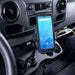 Unitech mobile scanner secured in an AgozTech cup holder vehicle cradle mount inside a commercial vehicle console.
