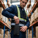Warehouse worker inserting Zebra TC77 into AgozTech holster case on waist belt